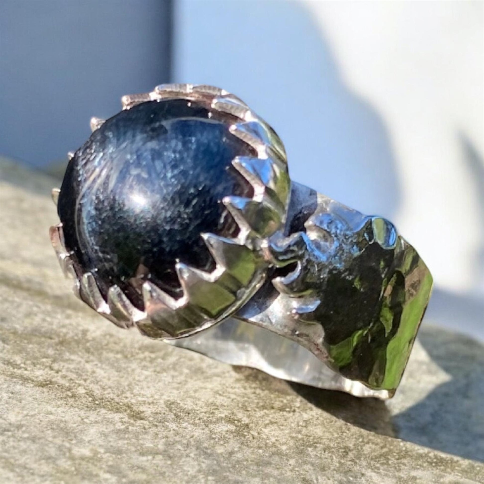 Handmade Blue Tiger's Eye sterling silver flame ring

Handcrafted Blue Tiger's Eye gemstone ring in sterling silver

Blue Tiger's Eye cabochon ring with flame bezel setting

One of a kind artisan sterling silver Blue Tiger's Eye ring