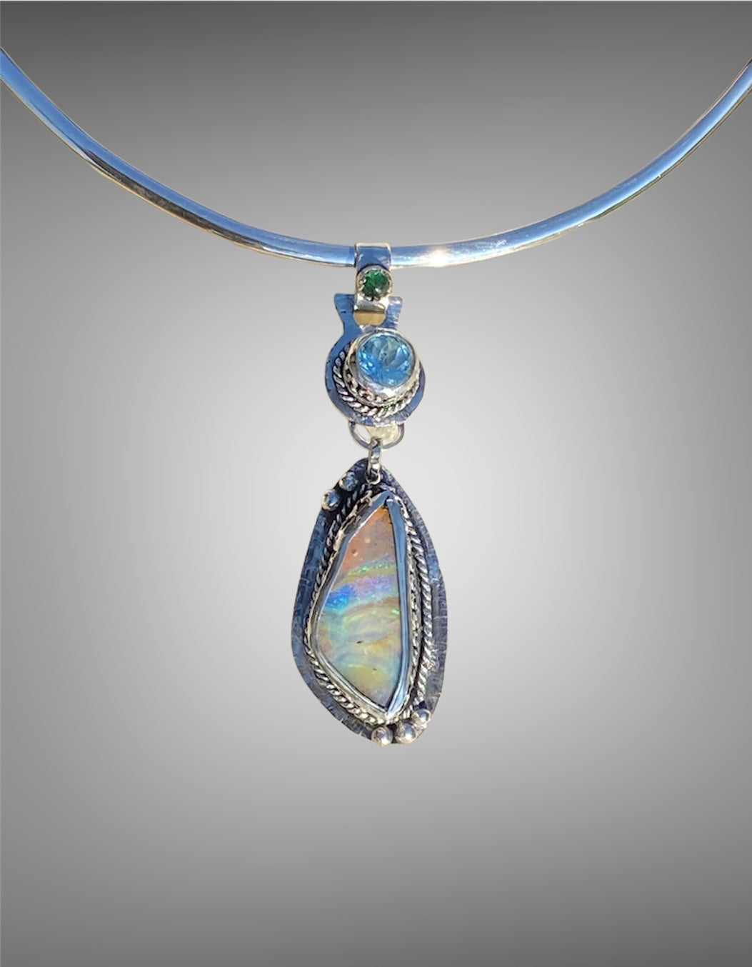 Opal, Blue Topaz and Emerald Pendant sold